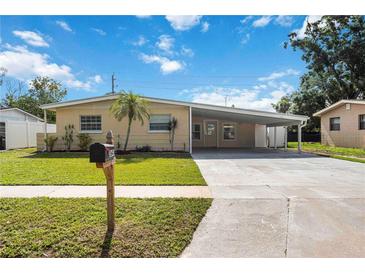 Charming single-story home with a covered carport and well-maintained front lawn at 3641 Stokes Dr, Sarasota, FL 34232