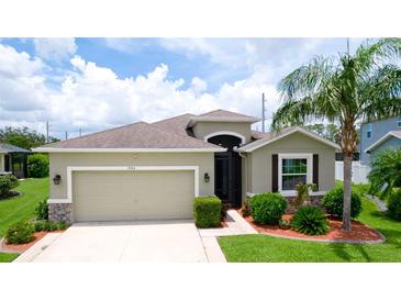 Well maintained home with mature landscaping, a two car garage, and neutral color palette at 7364 47Th Avenue E Cir, Bradenton, FL 34203