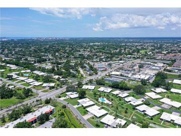 An aerial view shows the community's layout with well-maintained landscaping and convenient access to the city at 3641 Somerville Dr # 1506, Sarasota, FL 34232