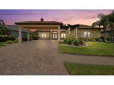 Stunning single-Gathering home featuring a porte-cochere and lush landscaping at 584 Mast Dr, Bradenton, FL 34208