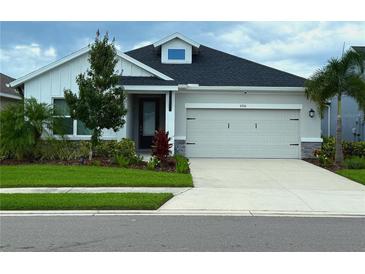 Charming single-Gathering home featuring a two-car garage and well-maintained landscaping at 8706 Arrow Creek Dr, Parrish, FL 34219