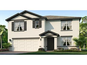 Inviting two-story home featuring a two-car garage and charming architectural details at 12063 Mountain Island Trl, Parrish, FL 34219