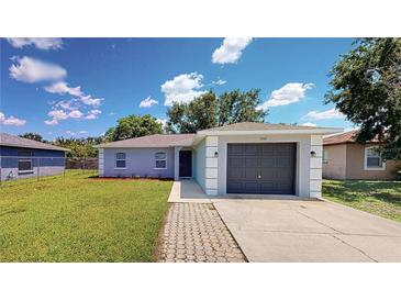 Charming single-story home with a well-maintained lawn and a one-car garage at 1707 24Th E St, Palmetto, FL 34221