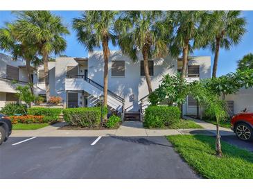 Multi-Gathering building with tropical landscaping, palm trees, and parking spots at 548 Lakeside Dr # 0, Bradenton, FL 34210
