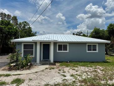 Charming single-story home featuring a new metal roof and a freshly painted exterior at 811 24Th Street E Ct, Bradenton, FL 34208