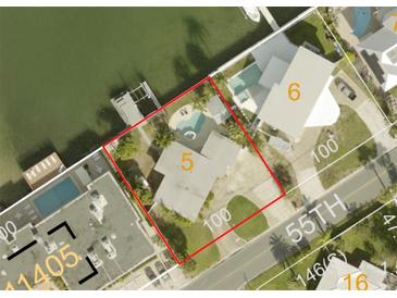 Aerial view shows a home with a pool and waterfront access at 205 55Th Ave, St Pete Beach, FL 33706