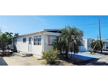 Charming single-story home with white siding and a well-maintained yard, offering a cozy and inviting curb appeal at 10315 Cortez W Rd # 24-2, Bradenton, FL 34210