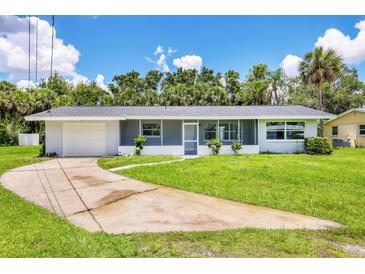 Charming single-story home features a well-maintained lawn and an attached garage at 116 Myakka Dr, Venice, FL 34293
