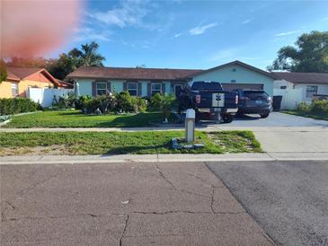 Charming single-story home with well-manicured lawn and mature landscaping in a desirable neighborhood at 1209 Croydonwood Cir, Brandon, FL 33510