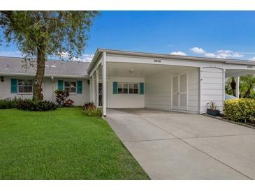 Charming home featuring a covered carport, well-manicured lawn, and inviting curb appeal at 4414 Mount Vernon Dr # 1, Bradenton, FL 34210