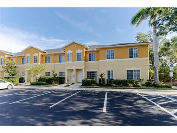 Inviting exterior showcasing the well-maintained facade, landscaping, and ample parking spaces at 13084 Tigers Eye Dr, Venice, FL 34292