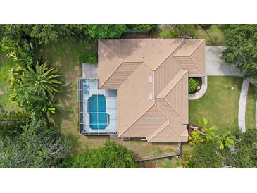 Overhead view of home featuring a screened-in pool, and a neutral-colored roof at 5619 Oak Grove Ct, Sarasota, FL 34233