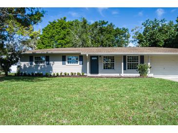 Charming single-story home featuring a well-manicured lawn, tidy landscaping and attached two-car garage at 616 59Th Nw St, Bradenton, FL 34209
