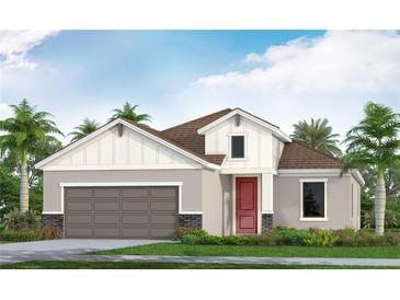 Charming single-Gathering home boasting a two-car garage, red door, and landscaped front yard for curb appeal at 6555 Big Bayou Dr, Sarasota, FL 34241