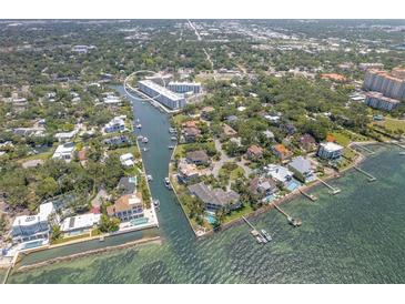 Stunning aerial view of waterfront homes and the condo community at 1709 N Tamiami Trail # Ph 514, Sarasota, FL 34234