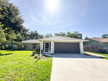 Charming single-story home with a well-manicured lawn and a two-car garage at 4913 32Nd E St, Bradenton, FL 34203