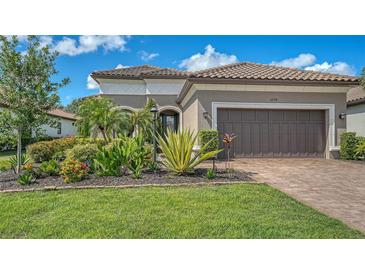 Beautiful single-Gathering home with a two-car garage and lush landscaping at 5234 Napoli Run, Bradenton, FL 34211