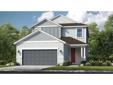 Charming two-story home with a gray color scheme, a two-car garage, and professional landscaping at 7072 Foxboro Way, Nokomis, FL 34275