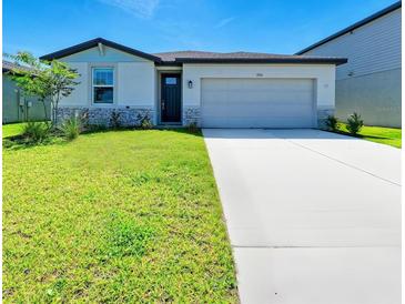 Charming single-Gathering home with a well-maintained lawn and two-car garage at 7160 Amelia River Dr, Parrish, FL 34219