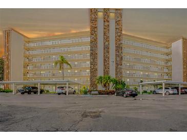 Spacious condo building with parking, landscaped grounds, and balconies at 3680 Ironwood Cir # 603L, Bradenton, FL 34209