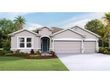 Inviting single-story home with a three-car garage, manicured lawn, and a welcoming front entrance at 16019 10Th E Ave, Bradenton, FL 34212