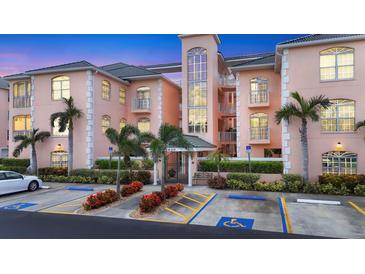 Attractive condo building featuring well maintained landscaping and accessible parking at 1613 Gondola Park Dr # 1613, Venice, FL 34292
