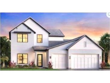 Charming two-story home with a three-car garage, modern design, and professionally landscaped front yard at 2593 Waterfront Cir, Sarasota, FL 34240
