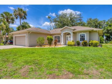 Charming home with a well-maintained lawn and inviting curb appeal in a desirable neighborhood at 4357 Mermell Cir, North Port, FL 34291