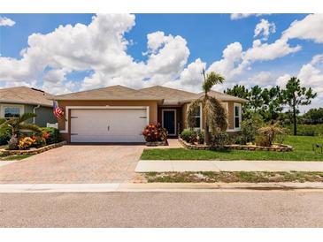 Charming single-story home featuring a brick driveway and well-maintained landscaping at 5301 Shell Mound Cir, Punta Gorda, FL 33982
