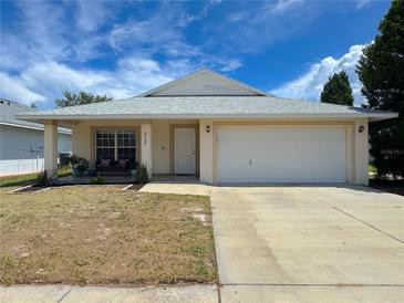 Charming single-story home featuring a two-car garage and a cozy front porch at 2122 Pleasure Run Dr, Ruskin, FL 33570