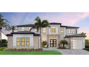 Stunning two-story home features a meticulously landscaped yard, a modern design, and elegant architectural details at 2425 Waterfront Cir, Sarasota, FL 34240