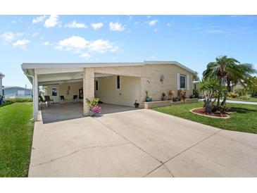 Charming single story home with a covered carport and well maintained lawn at 617 Fairmount Dr, North Port, FL 34287