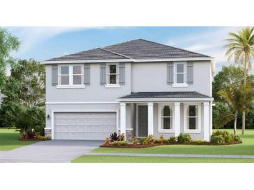 Charming two-story home showcasing a neutral palette, gray shutters, and a well-manicured lawn at 17936 Tavernside Trl, Lakewood Ranch, FL 34211