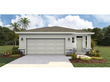 Charming single-story home featuring a two-car garage, stone accents, and well-manicured landscaping at 3222 Bitterroot Ln, Lakewood Ranch, FL 34211