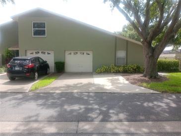 Charming home featuring a two-car garage and a well-maintained front yard at 4154 Center Pointe Cir # 57A, Sarasota, FL 34233