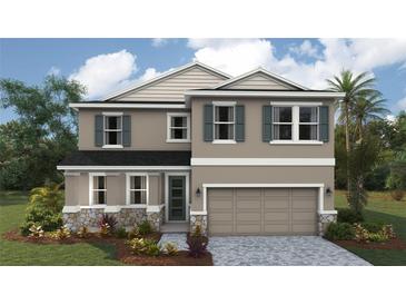 Charming two-story home featuring stone accents, a two-car garage, and stylish neutral color palette at 1757 Cobb Trl, Parrish, FL 34219