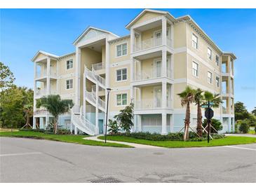 Stunning three-story building with lovely balconies and a beautifully landscaped exterior in a tropical setting at 7611 34Th W Ave # 301, Bradenton, FL 34209