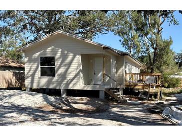 Cozy single-Gathering home with a front porch, surrounded by trees at 206 Patterson Ave, Osprey, FL 34229