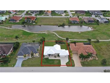 Aerial view of a single-Gathering home with a large backyard and a golf course nearby at 2325 Padre Island Dr, Punta Gorda, FL 33950