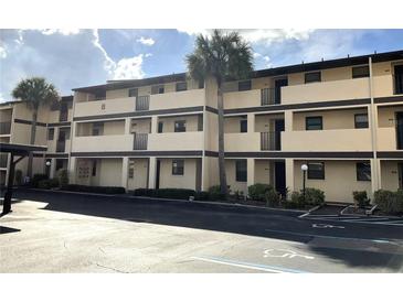 Two-story apartment building with parking and landscaping at 2395 Harbor Blvd # 224, Port Charlotte, FL 33952