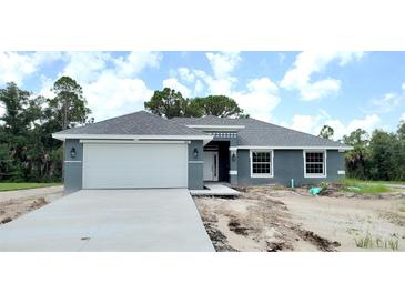 New construction home with attached two-car garage at 909 Biscayne Dr, Port Charlotte, FL 33953