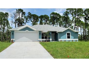 Single-Gathering home with a two-car garage and landscaped yard at 2552 Jacobs St, Port Charlotte, FL 33953