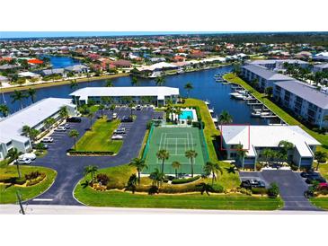 Aerial view highlighting building location and tennis court at 3600 Bal Harbor Blvd # 2-O, Punta Gorda, FL 33950