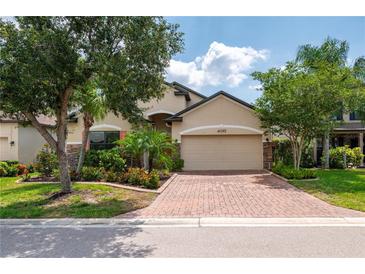 Attractive single-Gathering home with a brick driveway and lush landscaping at 4093 River Bank Way, Punta Gorda, FL 33980