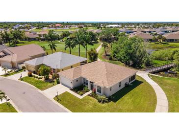 Single-story home with two-car garage, situated on a golf course at 24449 Manchester Trl, Punta Gorda, FL 33980