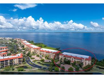Aerial view of waterfront condo building at 85 Vivante Blvd # 8534, Punta Gorda, FL 33950