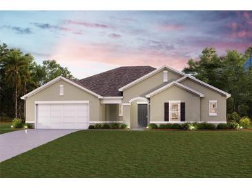 One-story home with a two-car garage and landscaping at 13395 High Springs Ave, Port Charlotte, FL 33981
