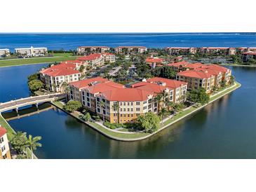 Aerial view of waterfront community with multiple buildings at 96 Vivante Blvd # 96211, Punta Gorda, FL 33950