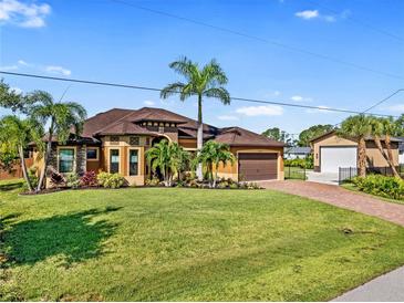 Single-Gathering home with attached garage and landscaping at 2129 Music Ln, North Port, FL 34286