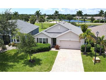 Single-Gathering home with landscaped yard and driveway at 28202 Arrowhead Cir, Punta Gorda, FL 33982